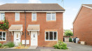 Two-storey brick semi-detached house with driveway and white front door.