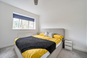 Bedroom with a double bed, bedside table and window