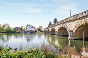 Scenic riverside views with historic bridge and waterfront setting