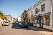 Town centre street lined with shops and businesses