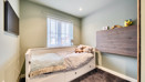 Single bedroom with bed, chest of drawers and window.