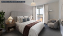 Modern bedroom with upholstered bed and reading chair at Brickmark Place, Bracknell