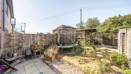 Rear garden with patio, lawn, fencing and outdoor seating area.