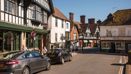 Historic town centre street with shops and traditional buildings