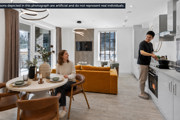 Modern open-plan apartment with contemporary kitchen, dining area and living room, featuring stylish furniture, large windows, and a resident preparing food in a bright, newly built home.