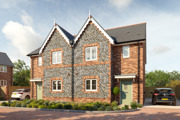 Plots 41 & 52, two semi-detached houses with flint detail and brickwork to the front and driveways either side.