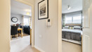 Hallway with doors leading to bedroom and living area.