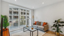Bright living room with balcony doors in the Horlicks Quarter show home in Slough