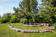 Landscaped community garden with outdoor seating and greenery