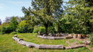 Landscaped community garden with outdoor seating and greenery