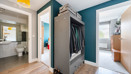 Hallway with storage, leading into bedrooms and bathroom.