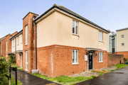 End-of-terrace house with brick and rendered exterior beside a footpath.