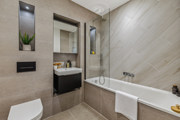 Modern bathroom with bath and vanity unit in the Horlicks Quarter show home in Slough