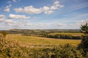 Open countryside with fields and rolling hills