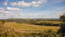 Open countryside with fields and rolling hills