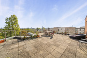 Private terrace with outdoor seating and views across neighbouring buildings.