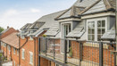 Balcony with table and two chairs.