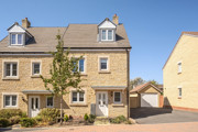 Three-storey semi-detached house with driveway and front garden.