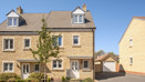 Three-storey semi-detached house with driveway and front garden.
